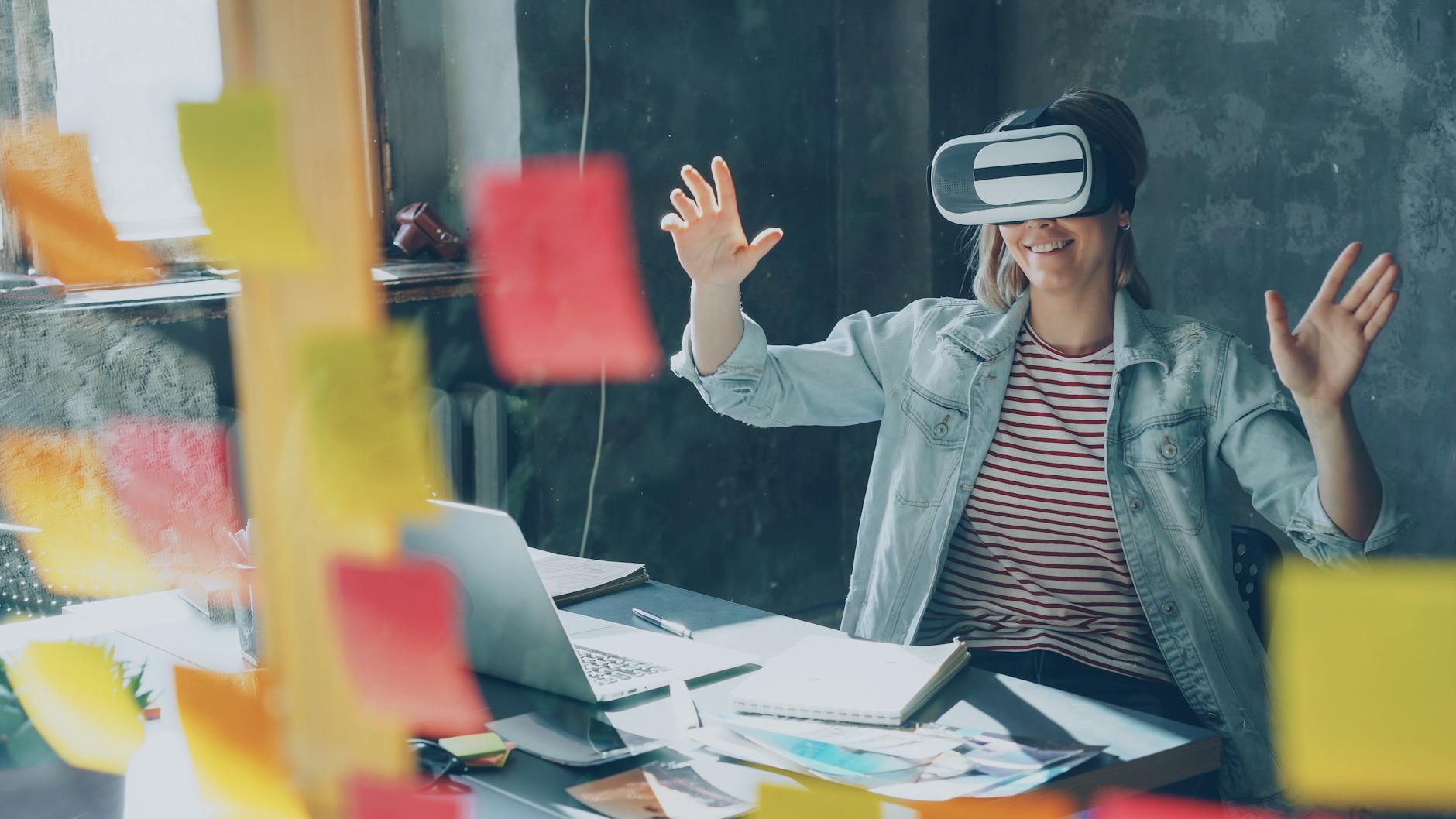 woman experiencing virtual reality in creative workspace